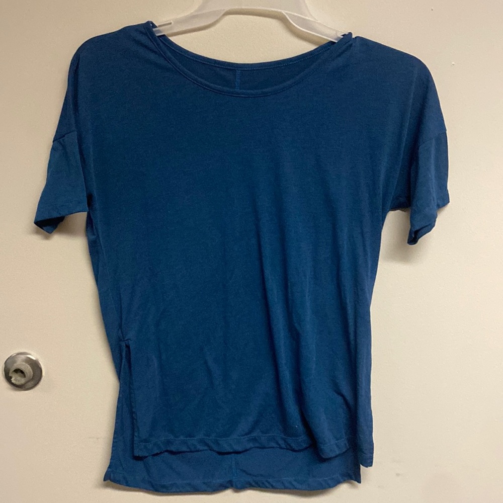 Casual Nike top with slots on the side.